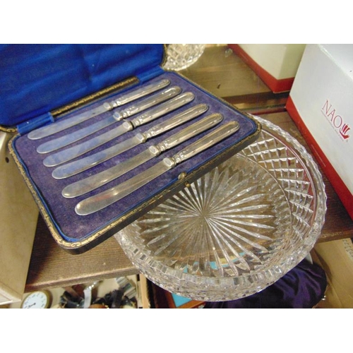 123 - Cased set of six silver handled dessert knives and a circular cut glass bowl.