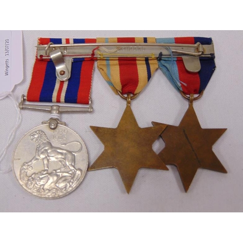 154 - World War Two medal trio to Pte. J. F. Mulhern (7517789), with Certificate of Transfer to the Army R... 