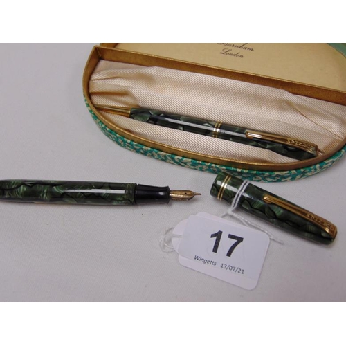 17 - Burnham of London green marbled fountain pen and matching propelling pencil, the pen with 14ct gold ... 