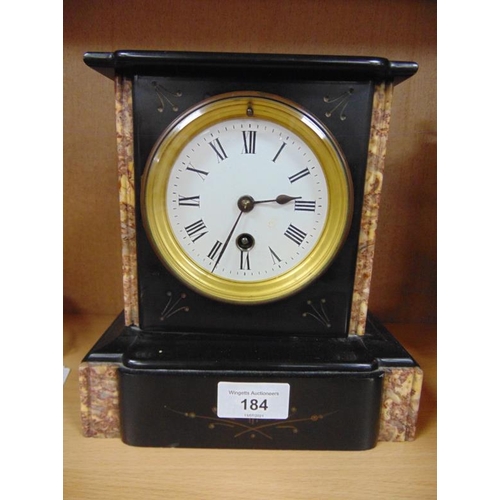 184 - Antique black slate and marble mantle clock, having enamel face and Roman numerals. 8 x 8 x 4.5