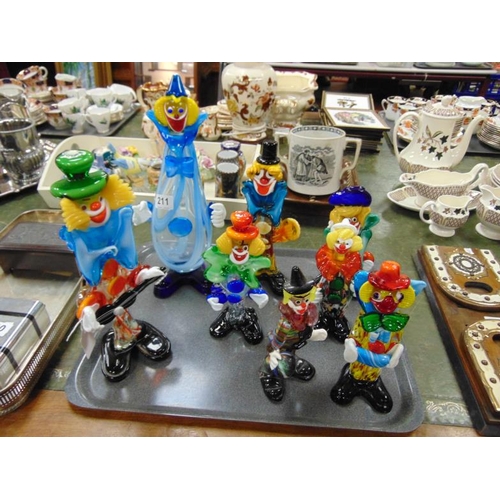 211 - Eight Murano glass clown figures.