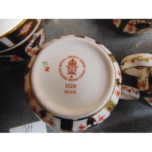 24 - Royal Crown Derby Old Imari dinner and tea service with heavy gold banding, 1128 pattern, first qual... 