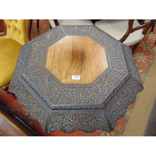 311 - Burmese hardwood centre table, the octagonal top decorated with hunting scenes, having pierced decor... 