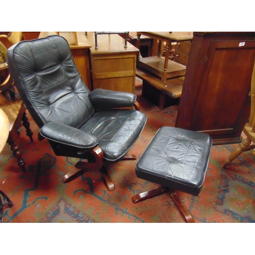 342 - Retro black leather swivel chair and matching stool.