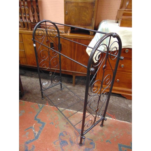 343 - Shaped metal stick stand, 35