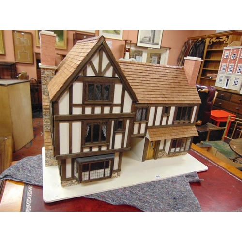 346 - Large wooden mock Tudor doll's house, 31 x 43 x 22