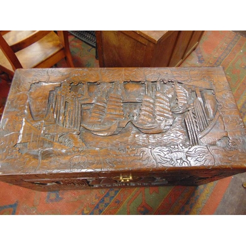 360 - Camphor wood chest, lift up lid, carved decoration and on bracket feet.