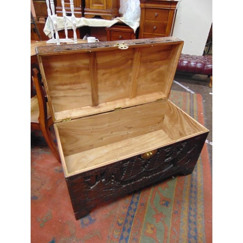 360 - Camphor wood chest, lift up lid, carved decoration and on bracket feet.