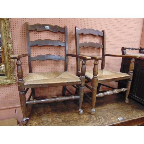 406 - Pair of beech framed ribbon backed arm chairs, having basket weave seats.