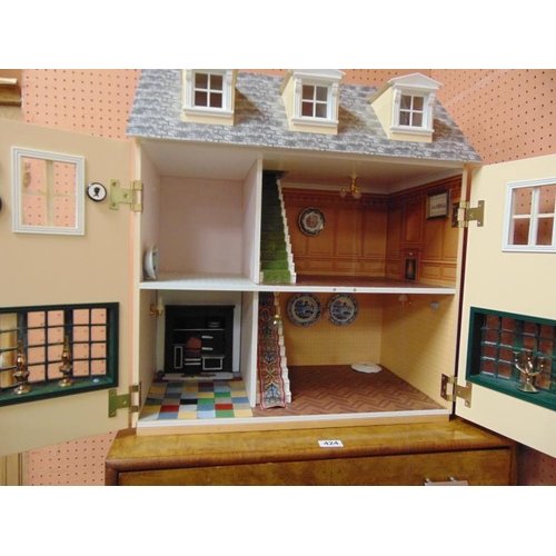 422 - Table top wooden doll's house, 26 x 23 x 14