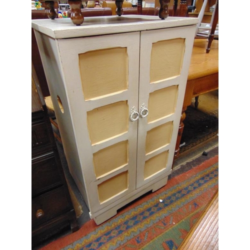 426 - Painted two door cupboard, having panel decoration. 39 x 22.5 x 18.5 