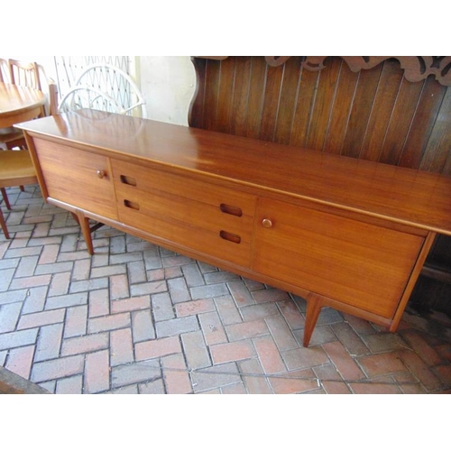 444 - G Plan teak dining suite comprising extending dining table, six chairs and sideboard.