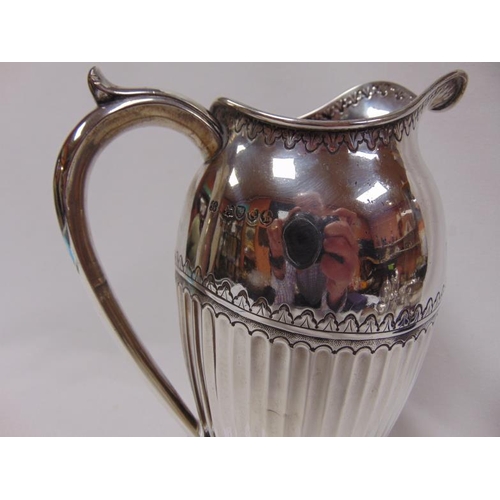 464 - 19th Century silver water jug  having gadrooned body, maker Holland, Son & Slater, London 1882. 19.9... 