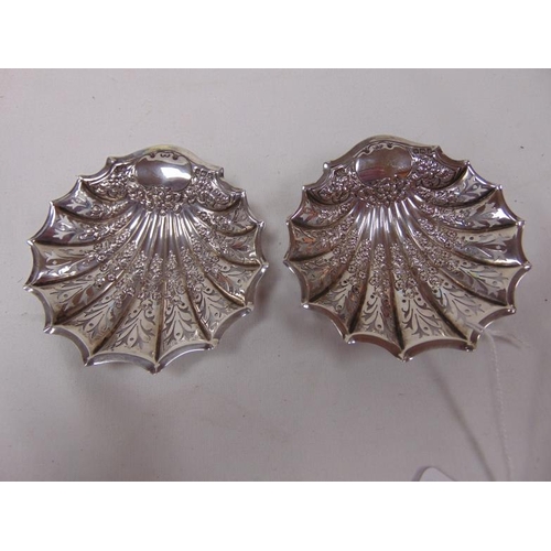 469 - Pair of silver shell form salts having pierced decoration, Sheffield 1906.