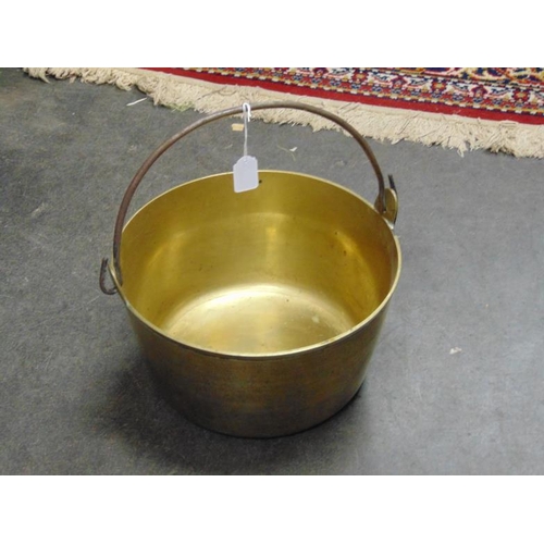 49 - Antique brass skillet with steel swing handle,