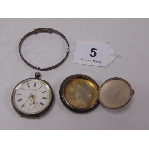 5 - Silver fob watch, silver pill box, and a silver child's bangle.