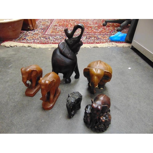 53 - Various carved wooden elephants.