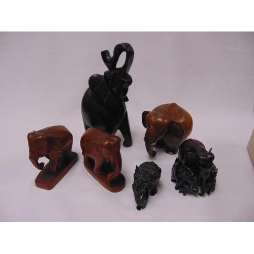 53 - Various carved wooden elephants.