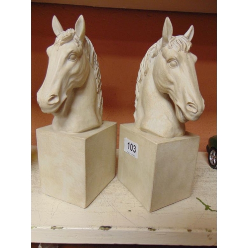 103 - Two composite horse head bookends.