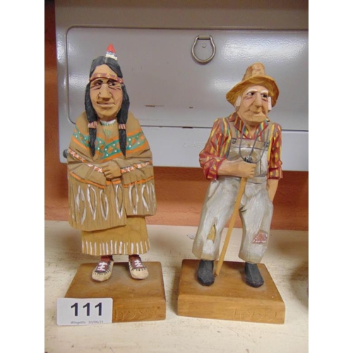 111 - Uygg, two hand carved and painted American figures.