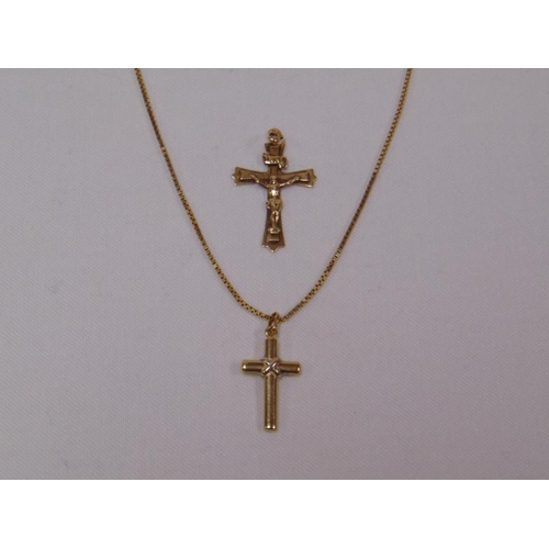 5 - 9ct yellow gold crucifix and chain, with another 9t yellow gold crucifix, 5.7g.