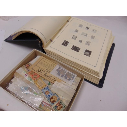 93 - Large stamp album and a box of loose stamps.