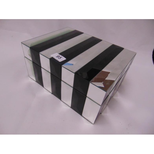 95 - Mirrored jewellery box with fitted interior.