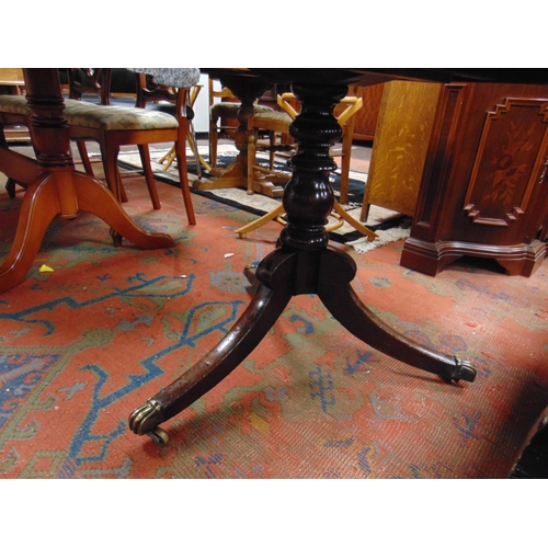 325 - Antique mahogany breakfast table, rectangular tilt top, having rounded corners on baluster turned co... 