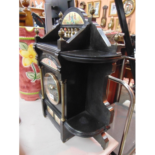 255 - Antique black slate mantle clock, having inlaid panels depicting classical scenes and having Roman n... 