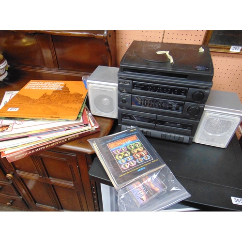 271 - Small quantity of records, tapes, and an Alba record player / cassette / radio.