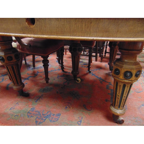 345 - 19th century oak extending dining table, oval ends, on five fluted turned supports and castors, with... 