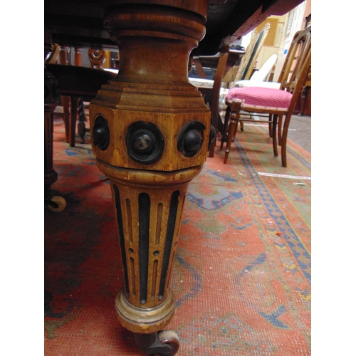 345 - 19th century oak extending dining table, oval ends, on five fluted turned supports and castors, with... 