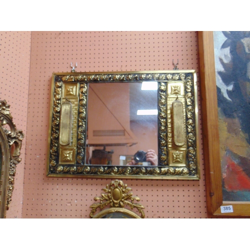 384 - Ornate reproduction gilt framed wall mirror, and a hall mirror (2).