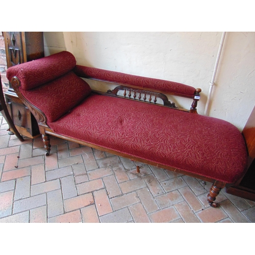 443 - Late 19th beech framed chaise, all over upholstery on short supports and castors. 70