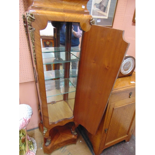 453 - Extremely ornate reproduction walnut cabinet, having applied French clock and gilt metal mounts, sin... 