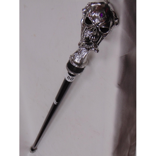 80 - Reproduction walking cane with skull design handle.