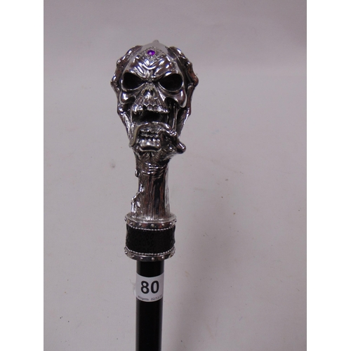 80 - Reproduction walking cane with skull design handle.