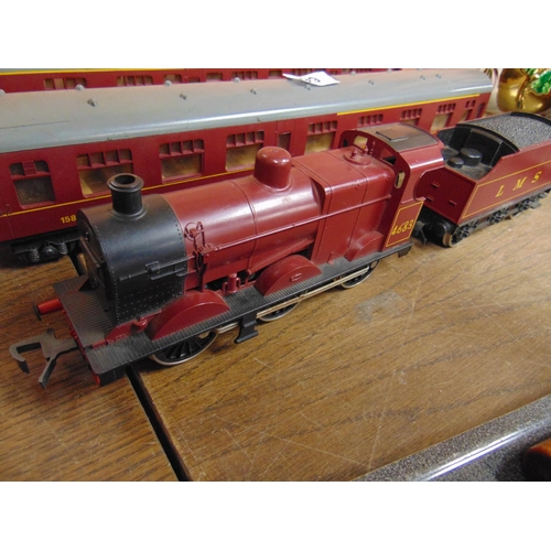 99 - Lima LMS locomotive, tender and two carriages.