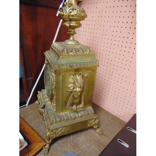 105 - Ornate 19th century gilt metal cased mantle clock, 24