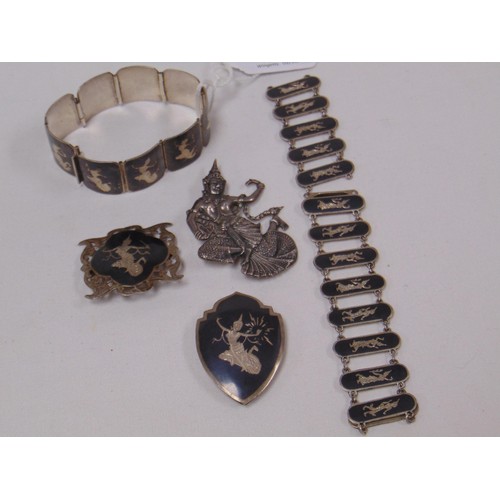 22 - Five pieces of Siamese white metal jewellery.