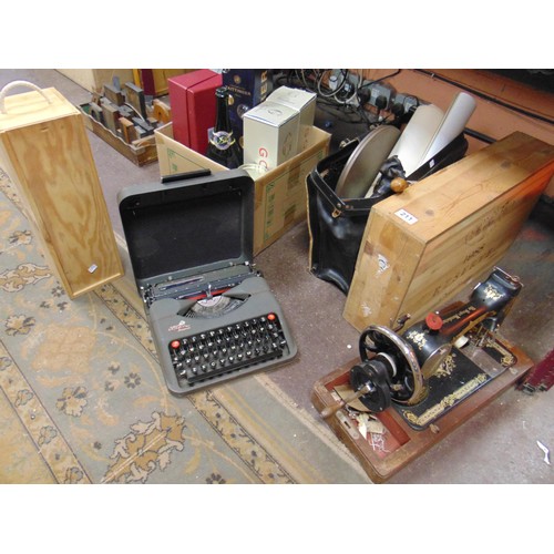 211 - Mixed lot, to include a travel typewriter, wooden wine box, satchel, walking stick, Singer sewing ma... 