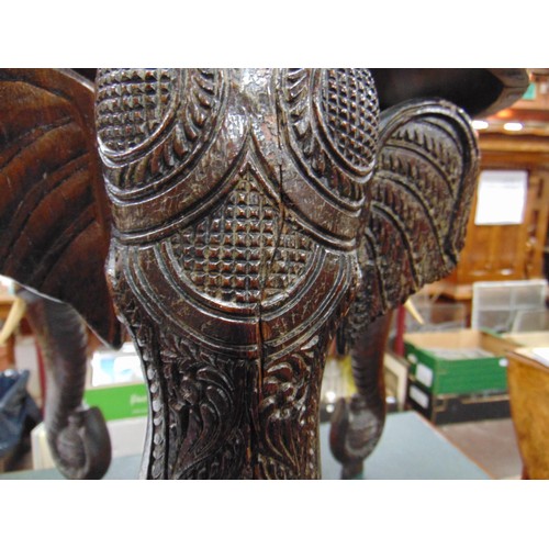 165 - Anglo Indian centre table, heavily carved with elephant head form supports, 19