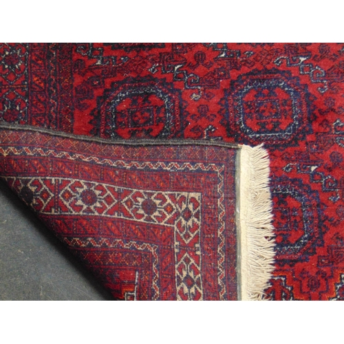 23 - Persian Meshed Belouch red ground handmade wool rug, 82 x 40