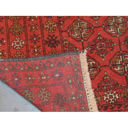 25 - Persian red ground handmade wool rug, 82 x 44