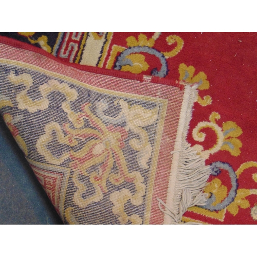 108 - Red ground floral carpet, 90 x 67