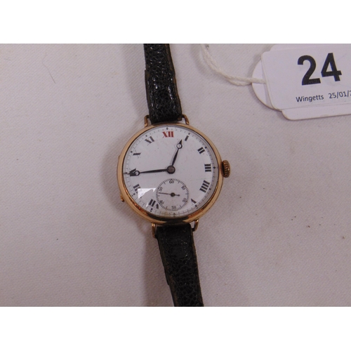 24 - Antique gold plated wristwatch, white enamel dial with Roman numerals and subsidiary seconds dial.