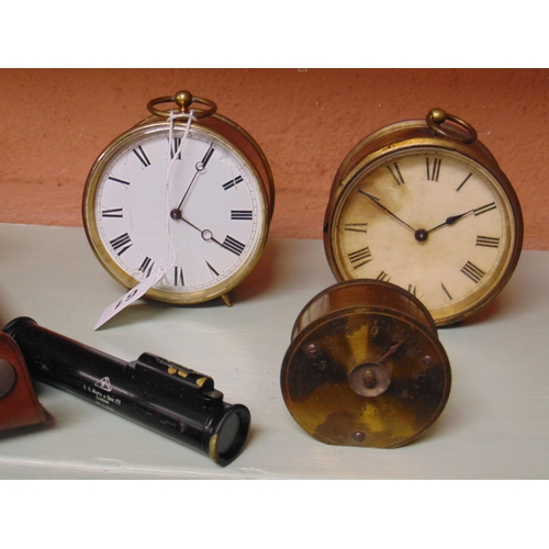 61 - Two circular brass cased dial clocks, surveyor's level in leather case, and an antique brass cased t... 