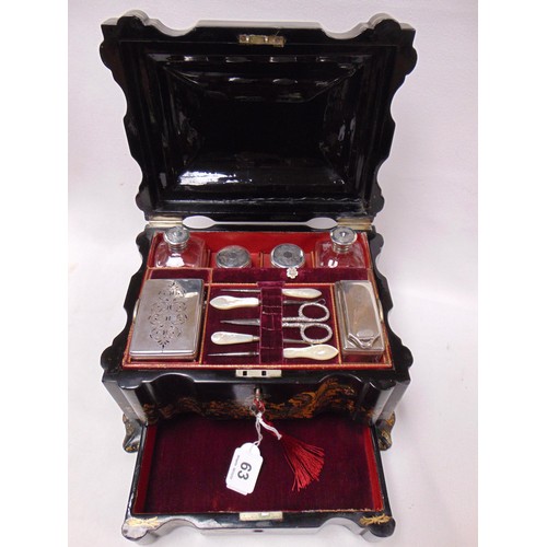 20 - Victorian black lacquered papier mache ladies travelling vanity set of serpentine form, gilded and i... 