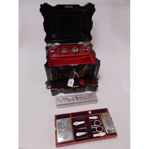 20 - Victorian black lacquered papier mache ladies travelling vanity set of serpentine form, gilded and i... 