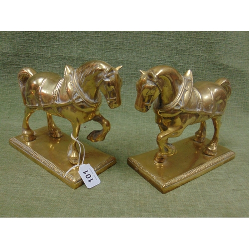 101 - Pair of heavy cast brass horse figures.